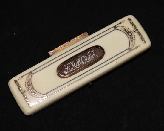 A George III ivory toothpick case, with gold pique decoration and centred with LAMOUR hair cartouche.